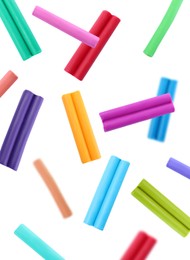 Image of Colorful plasticine  pieces falling on white background