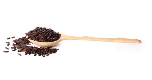 Spoon and uncooked black rice on white background