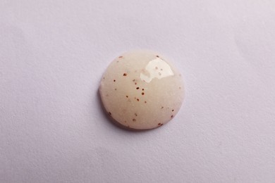 Photo of Sample of face scrub on pink background, top view