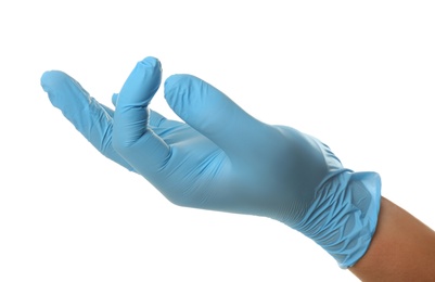 Person in blue latex gloves holding something against white background, closeup on hand