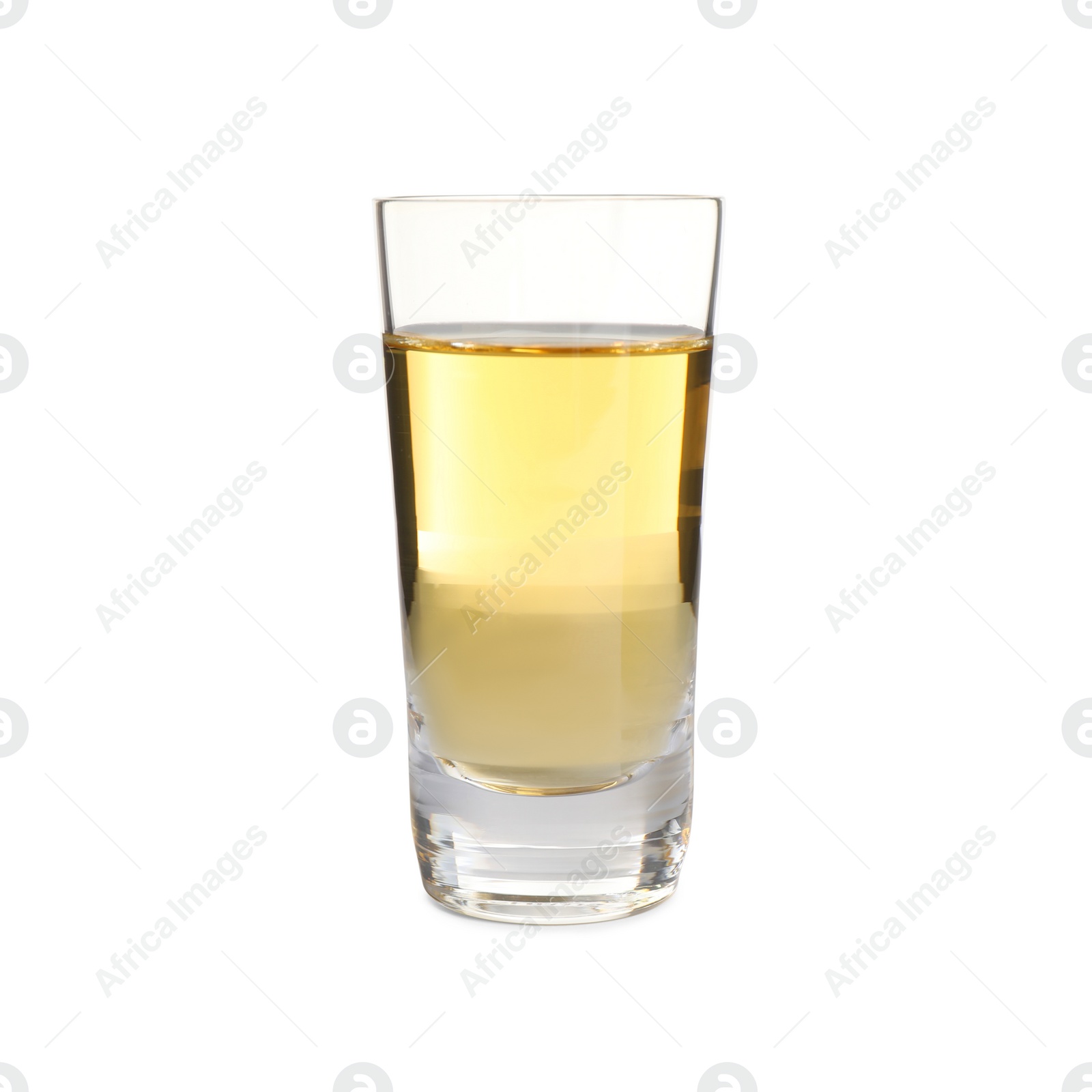 Photo of Mexican Tequila in shot glass isolated on white