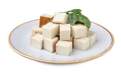 Plate with delicious fried tofu and basil on white background