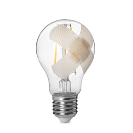Photo of Light bulb with sticking plasters isolated on white