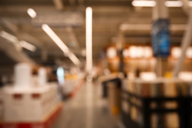 Photo of Blurred view of modern shopping mall interior