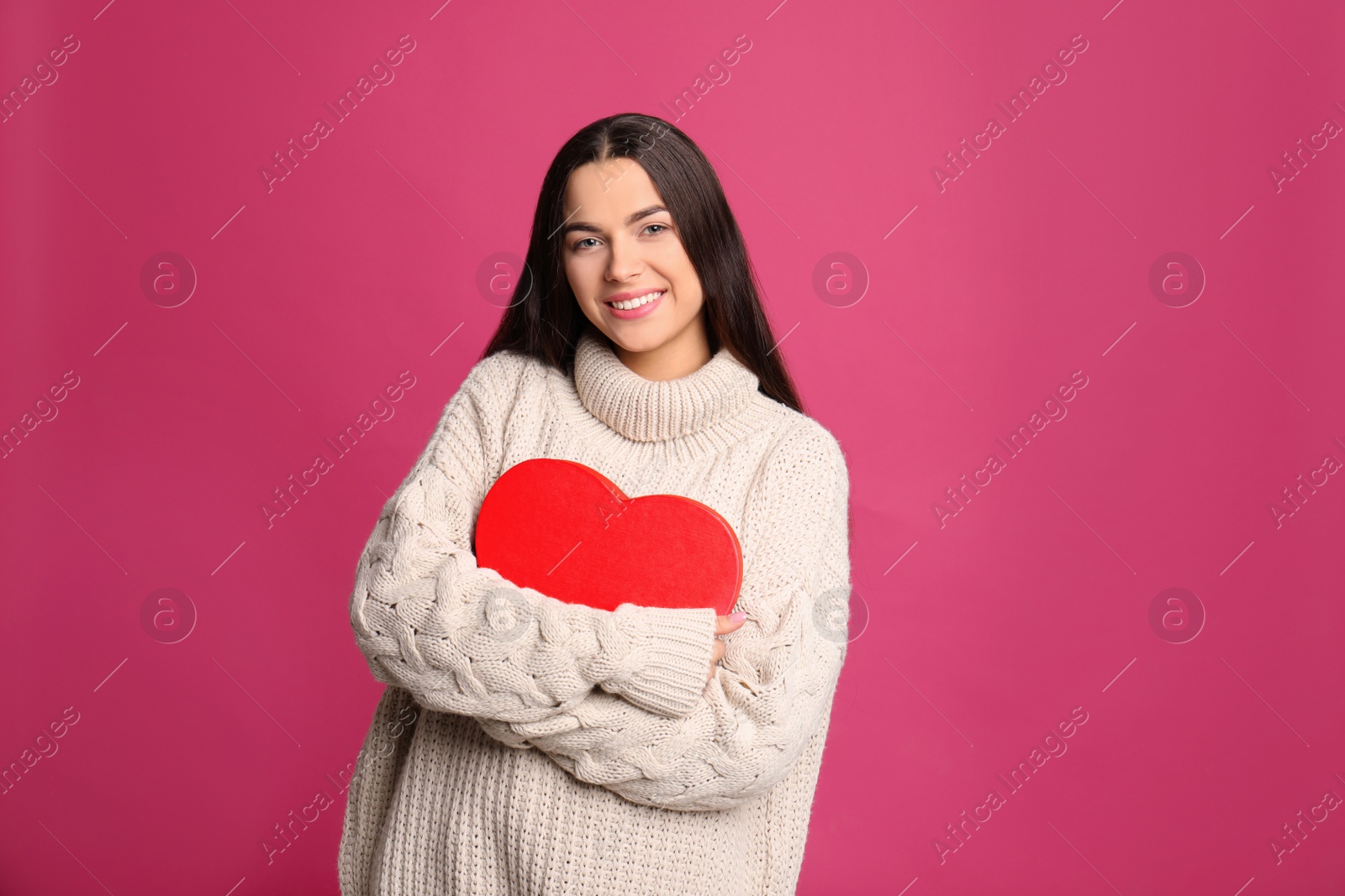 Photo of Portrait of young woman with decorative heart on color background