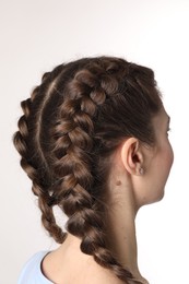 Photo of Woman with braided hair on light background