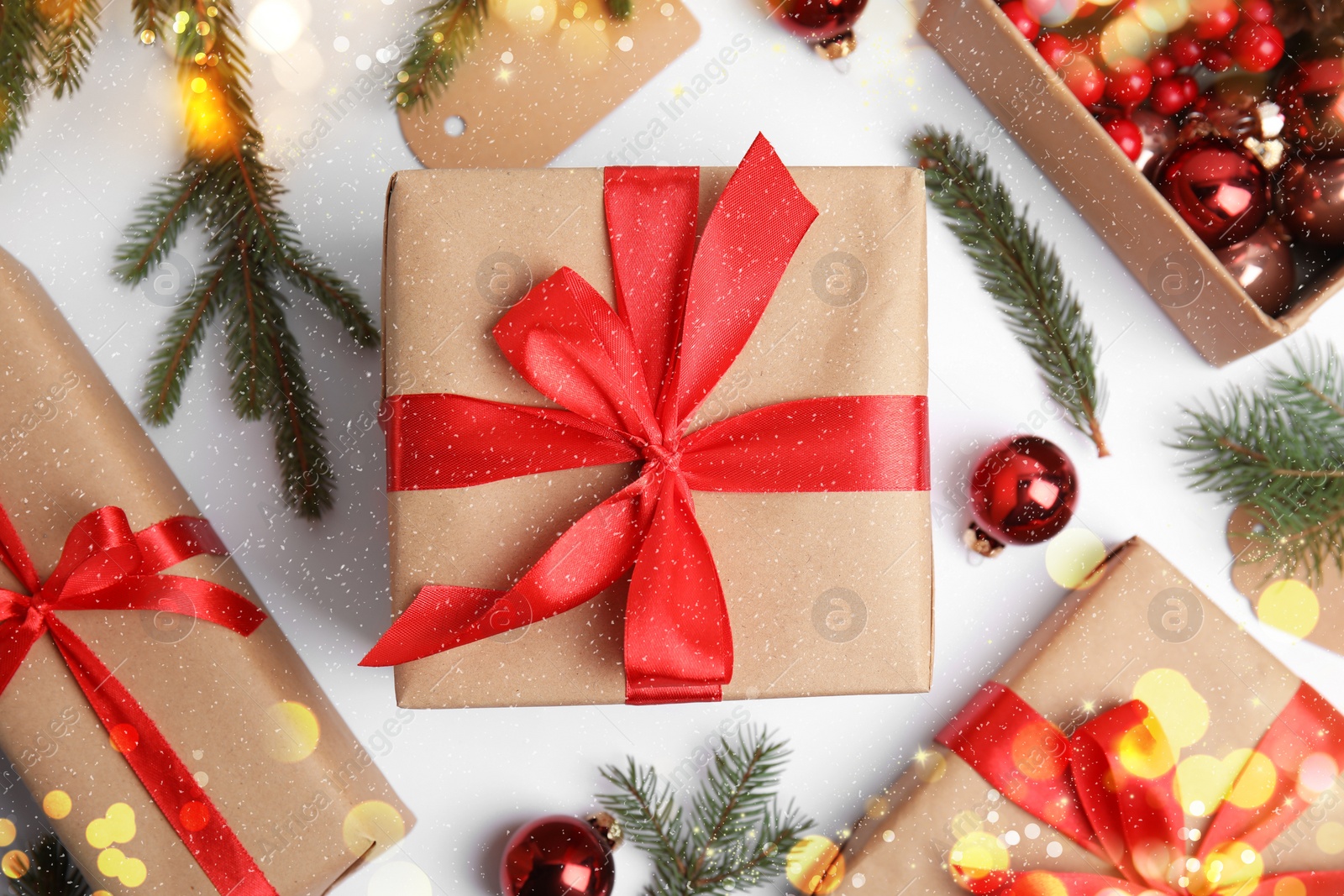 Image of Composition with gift boxes and Christmas decor on white background, flat lay