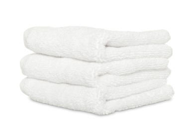 Photo of Folded soft terry towels on white background
