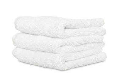 Folded soft terry towels on white background