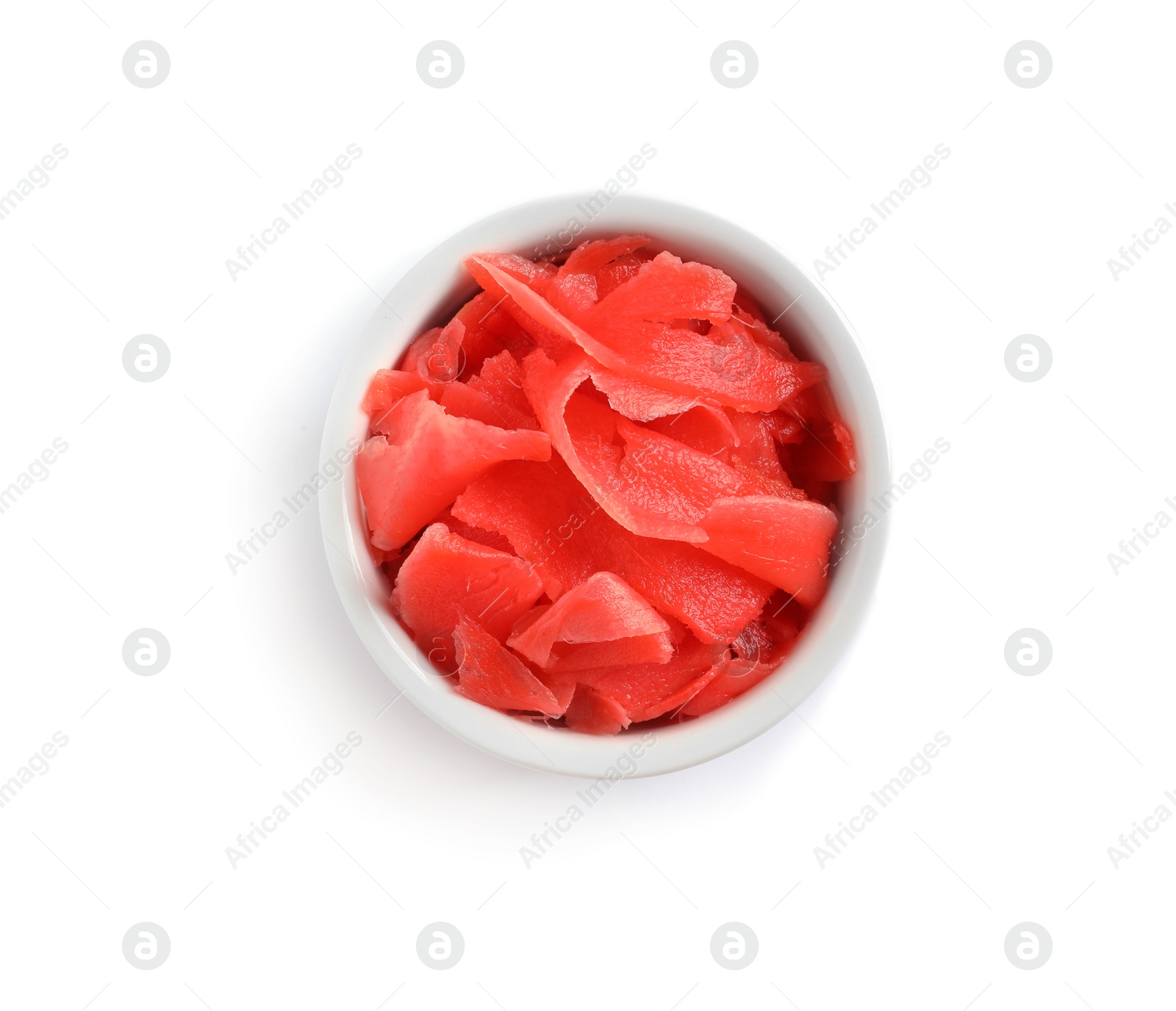 Photo of Piquant pickled ginger in bowl on white background, top view.  Delicious sauce condiment