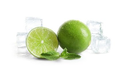 Fresh ripe limes and ice cubes on white background