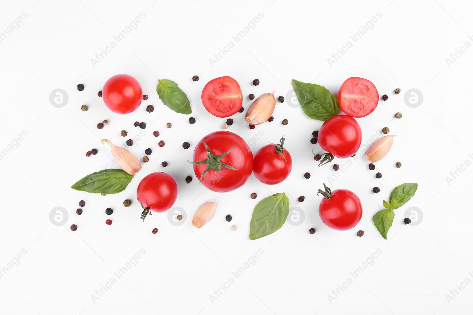 Photo of Flat lay composition with different whole and cut tomatoes on white background