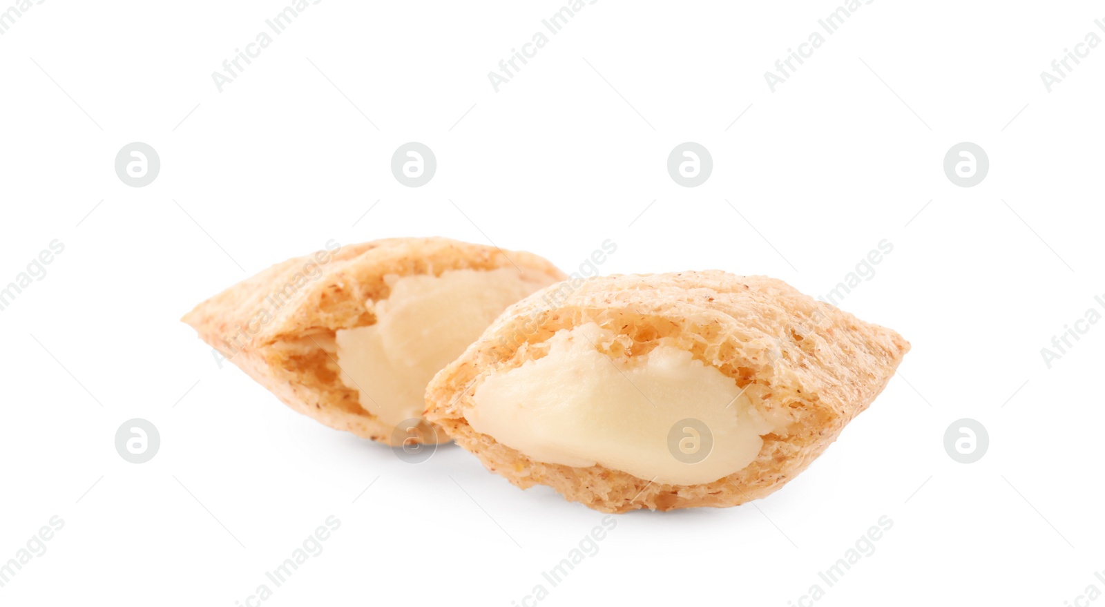 Photo of Broken corn pads with milk filling on white background