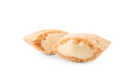 Photo of Broken corn pads with milk filling on white background