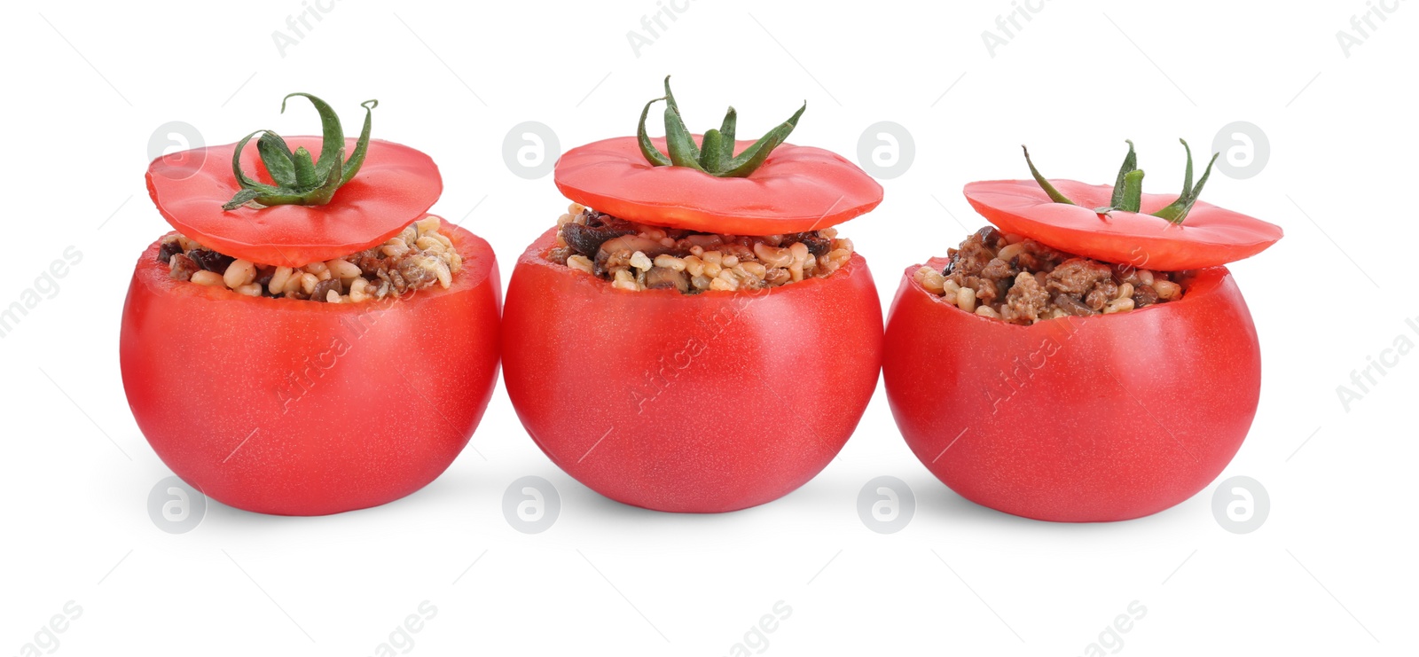 Photo of Delicious stuffed tomatoes with minced beef, bulgur and mushrooms isolated on white