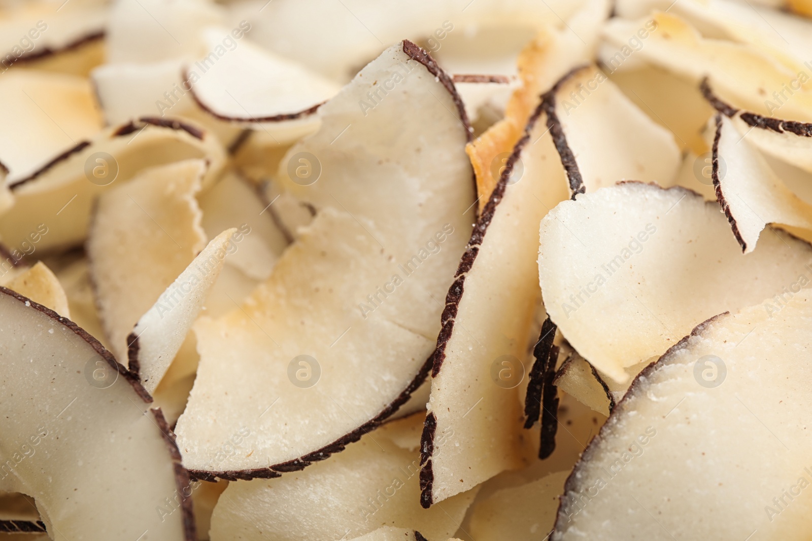 Photo of Delicious fresh coconut chips as background, closeup