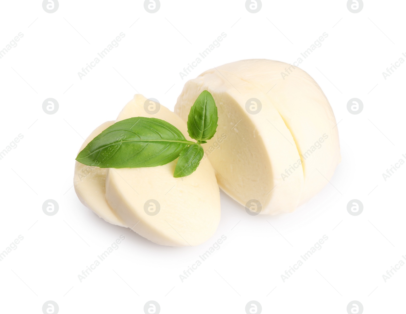 Photo of Slices of tasty mozzarella and basil leaves isolated on white