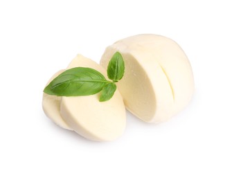 Slices of tasty mozzarella and basil leaves isolated on white