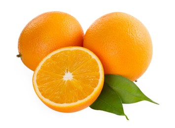 Whole and cut ripe oranges isolated on white