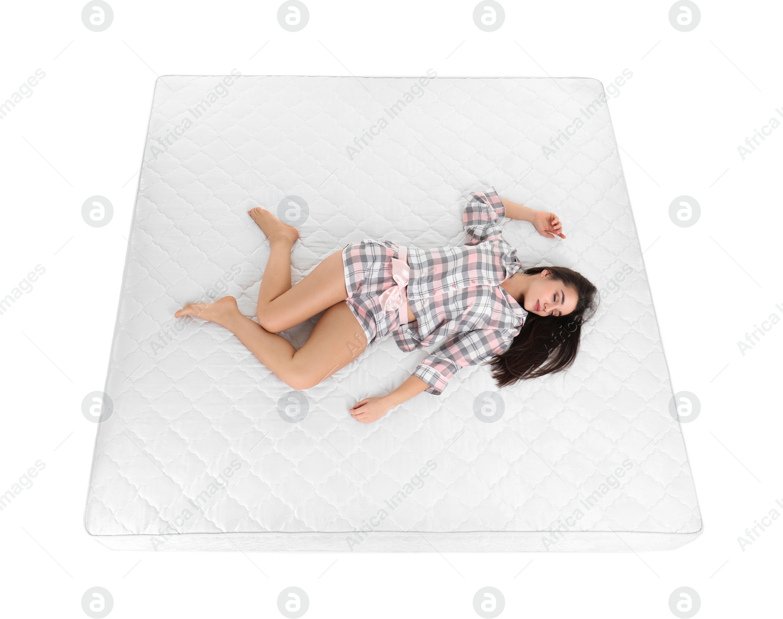 Photo of Young woman sleeping on mattress against white background, above view