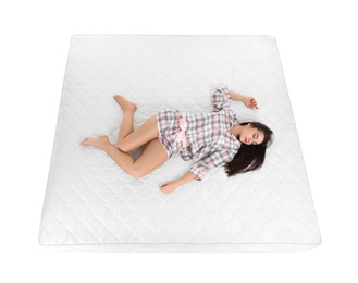 Young woman sleeping on mattress against white background, above view