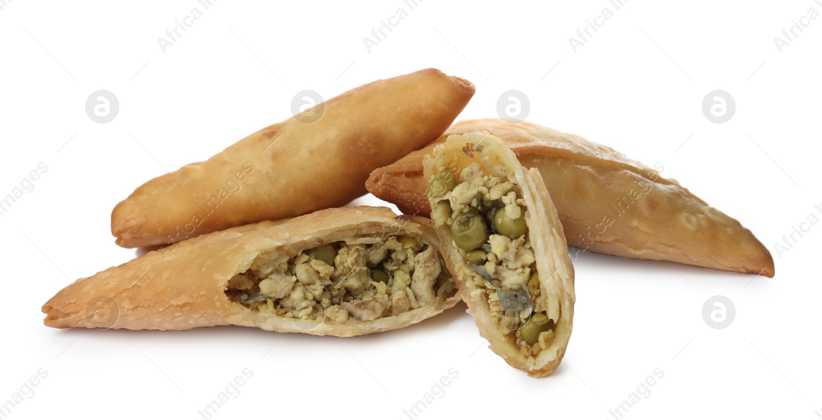 Photo of Fresh whole and cut samosas on white background