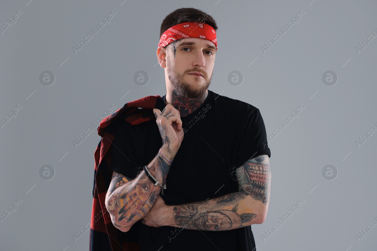 Photo of Portrait of handsome hipster man on light grey background