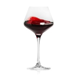 Image of Red wine splashing in glass on white background