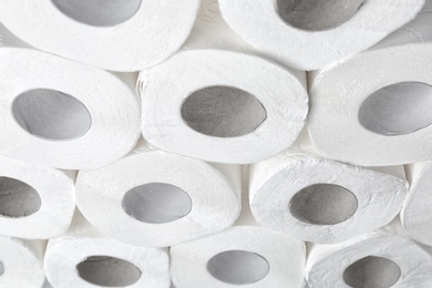 Photo of Many rolls of toilet paper as background. Personal hygiene