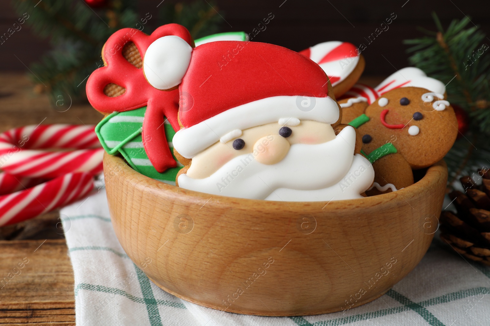 Photo of Tasty Christmas cookies on wooden table, closeup