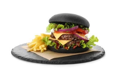 Slate plate with black burger and French fries isolated on white