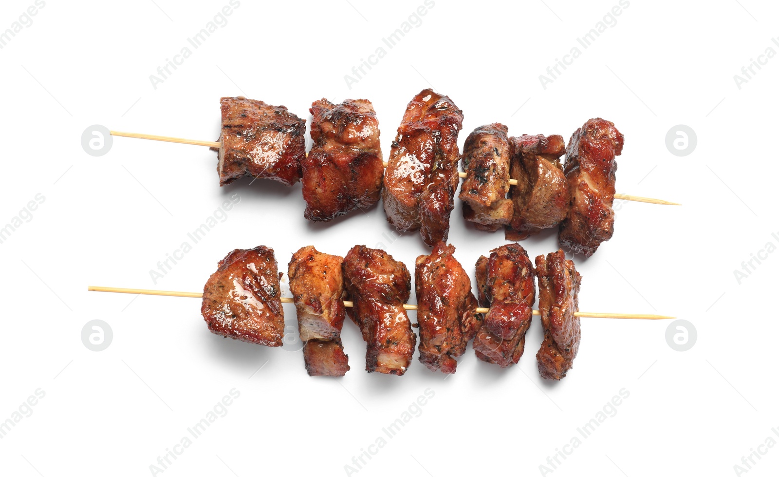 Photo of Delicious shish kebabs isolated on white, top view