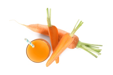 Photo of Freshly made carrot juice on white background, top view