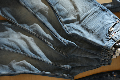 Photo of Modern blue jeans on display in shop