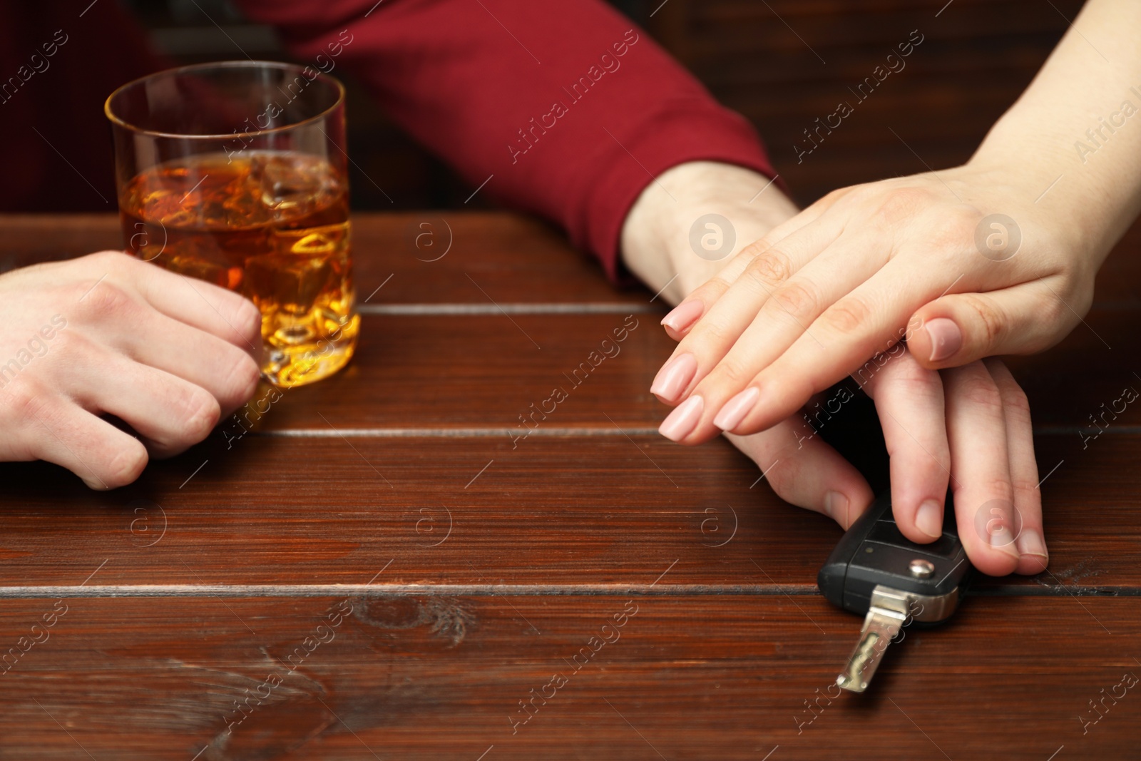 Photo of Woman stopping drunk man from taking car keys, closeup. Don't drink and drive concept