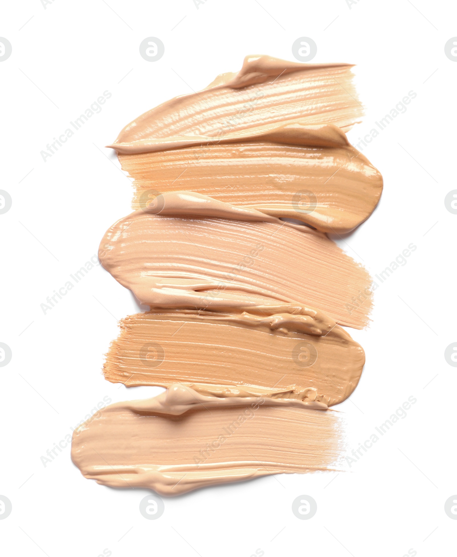 Photo of Samples of skin foundation on white background, top view