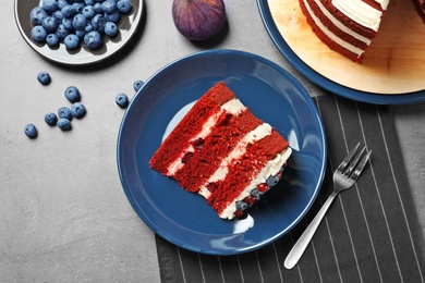 Delicious homemade red velvet cake served on table, flat lay