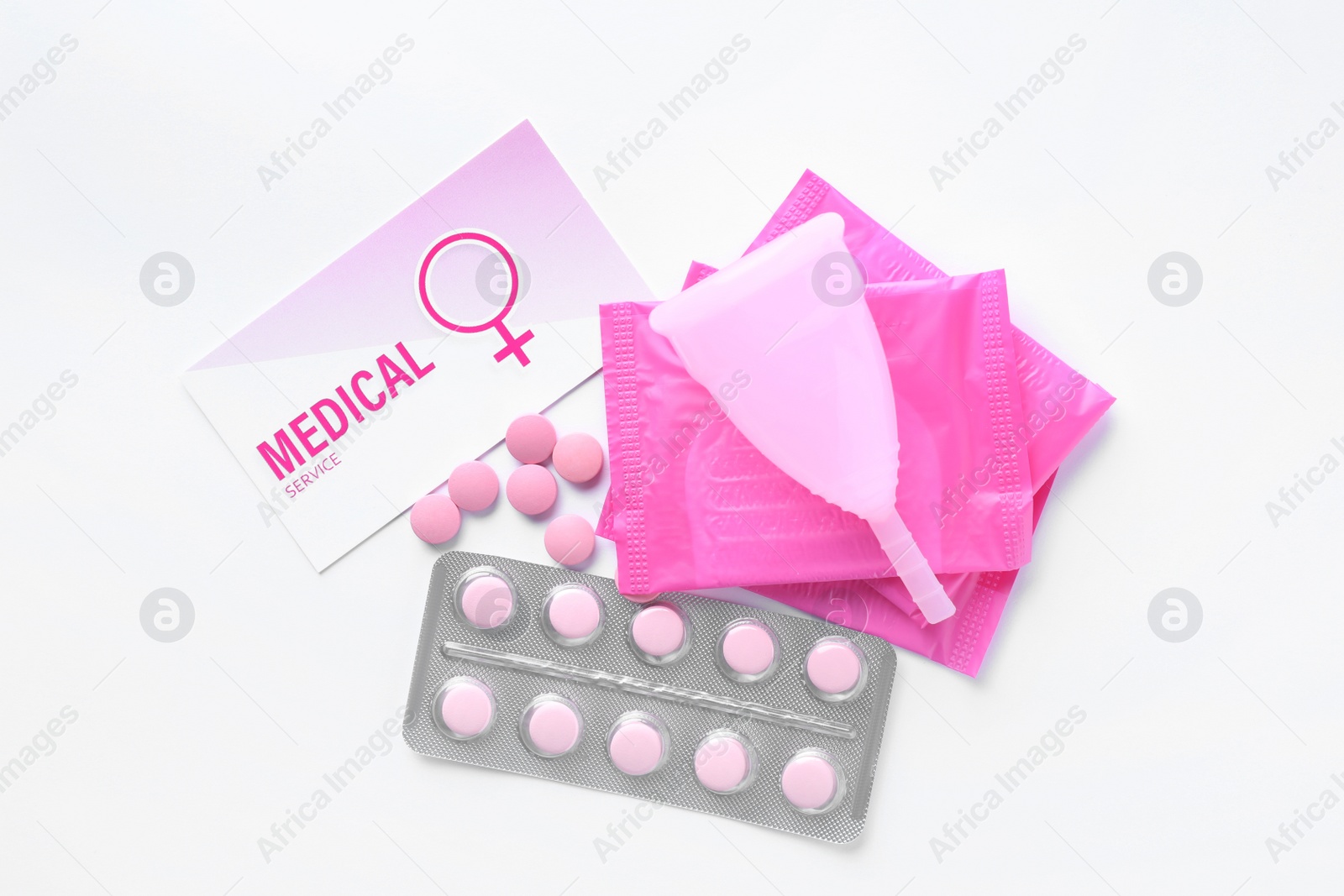 Photo of Pills, menstrual pads and cup on white background, top view. Gynecology concept