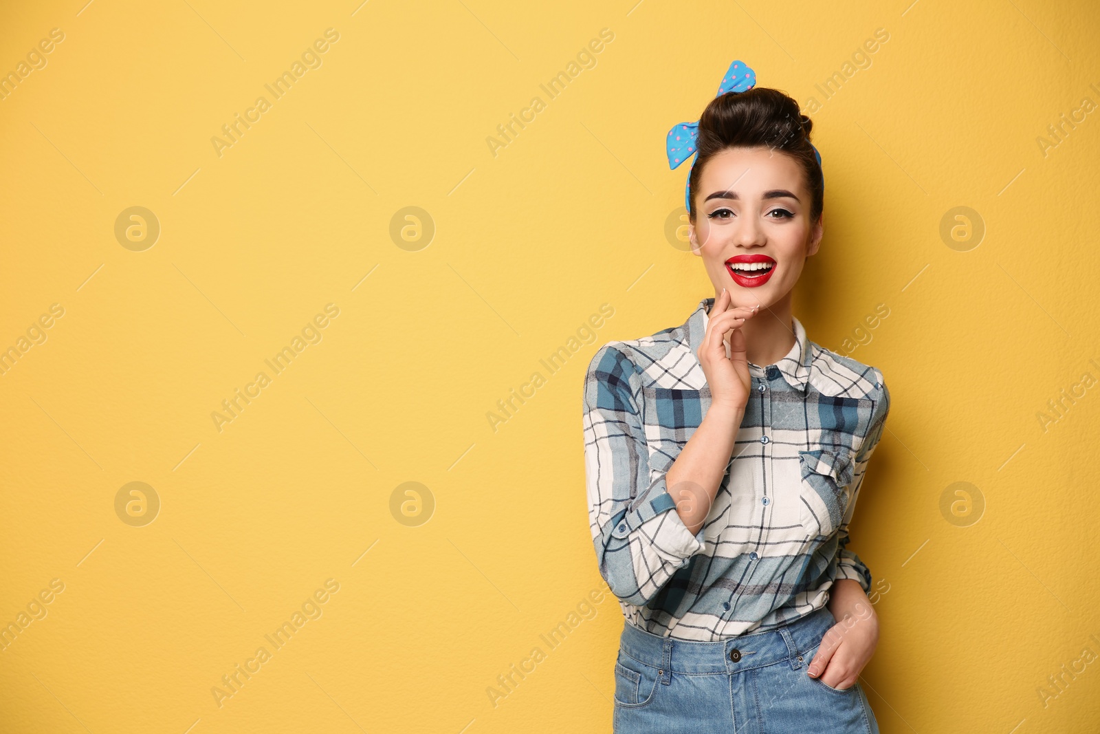 Photo of Portrait of funny young housewife on color background