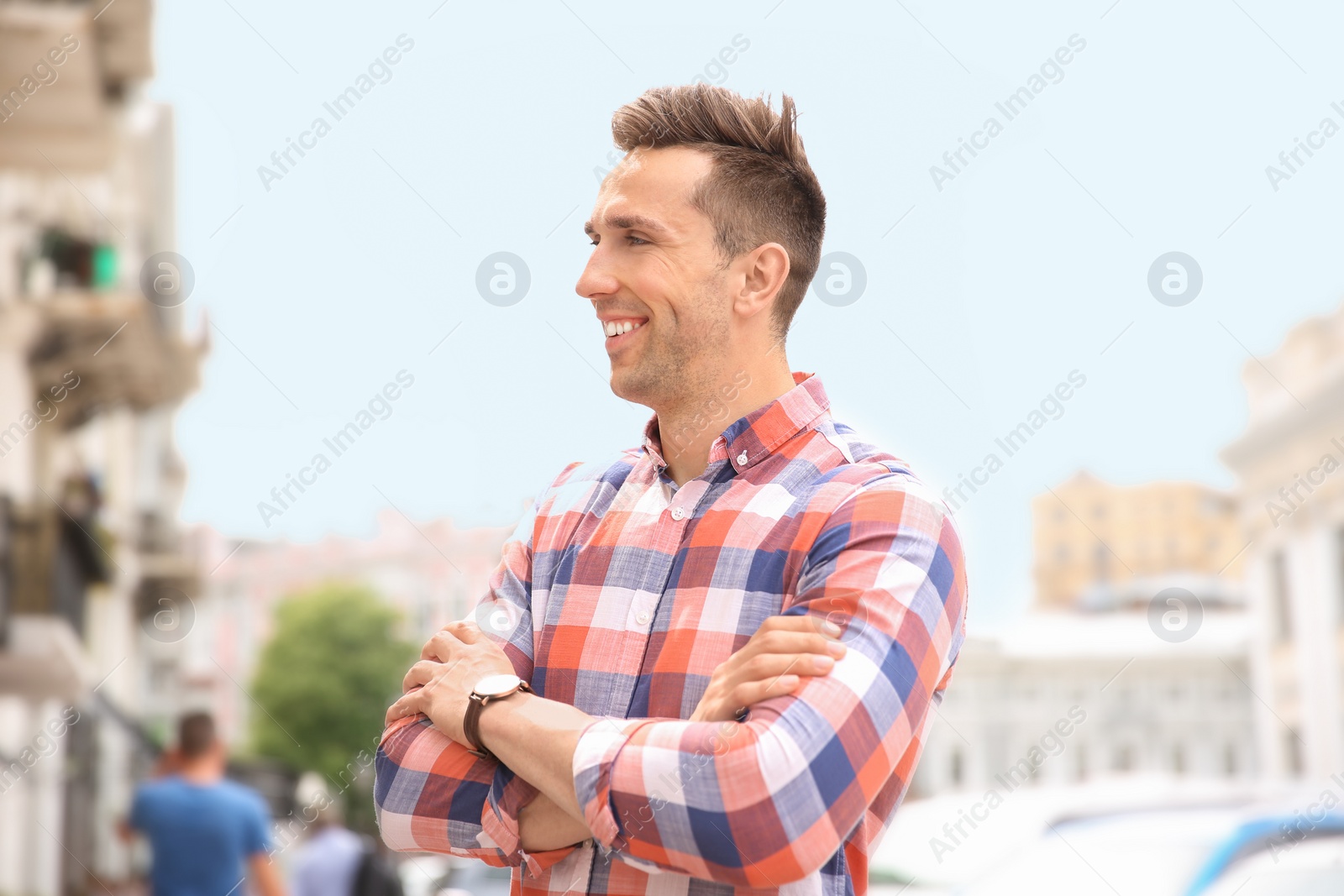 Photo of Portrait of attractive young man in stylish outfit outdoors