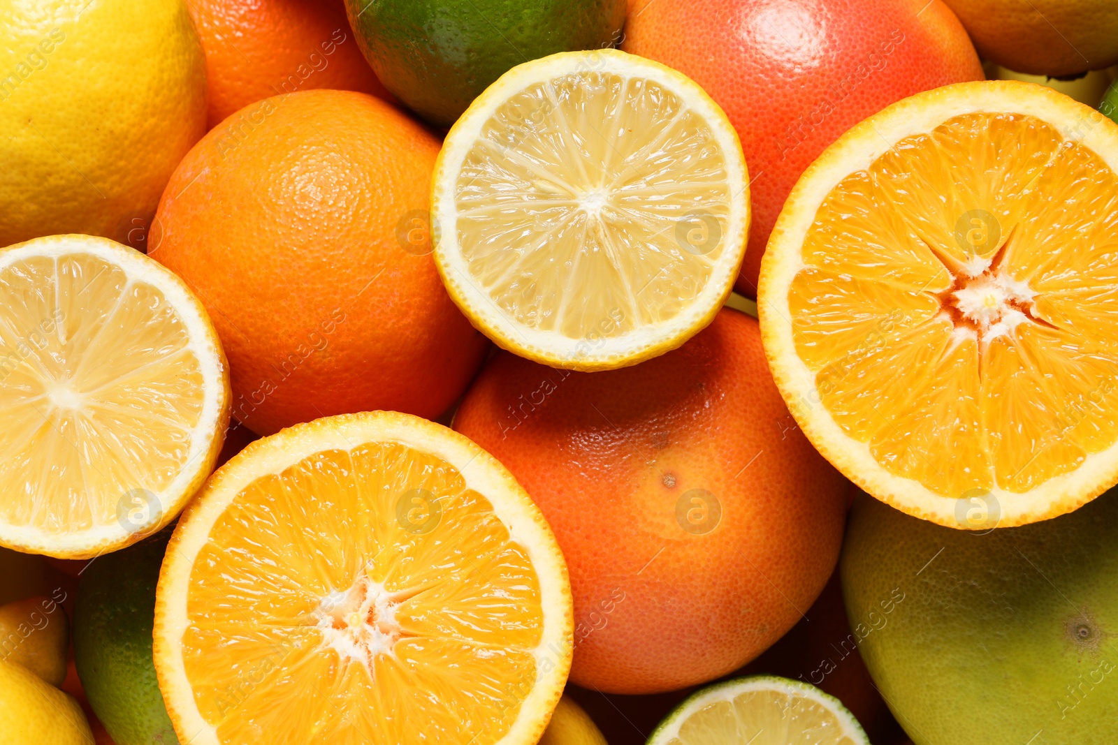 Photo of Different fresh citrus fruits as background, top view