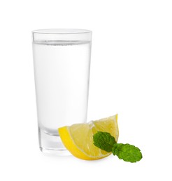 Photo of Glass of vodka, mint and lemon isolated on white