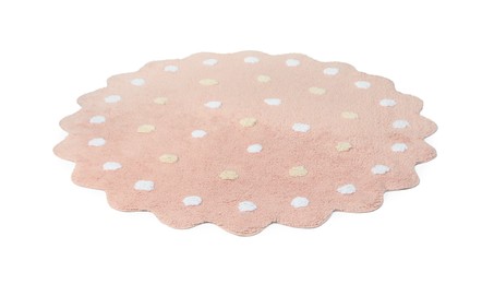 Photo of Round pink rug with polka dot pattern isolated on white