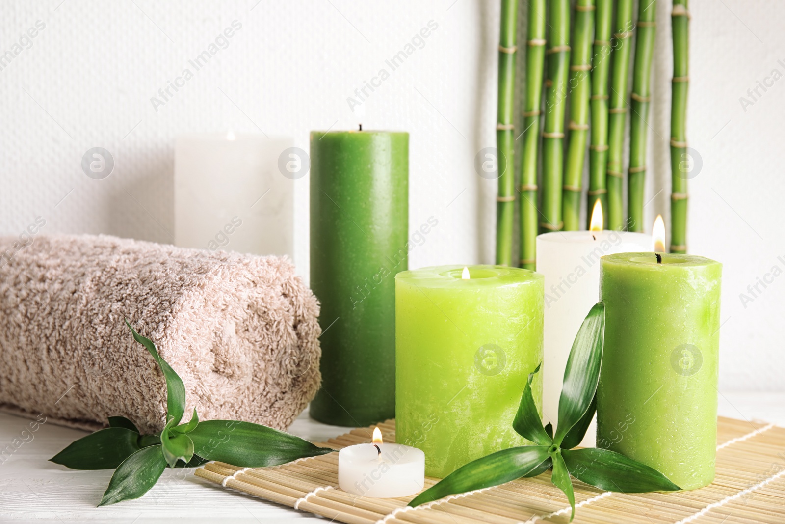 Photo of Beautiful spa composition with green candles on table