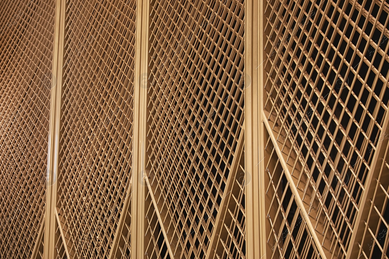 Photo of Golden metal construction on dark background. Modern design