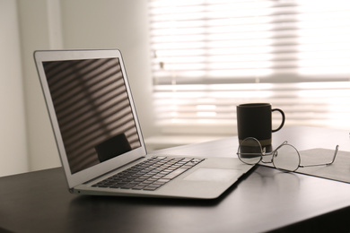 Modern laptop on office table. Stylish workplace