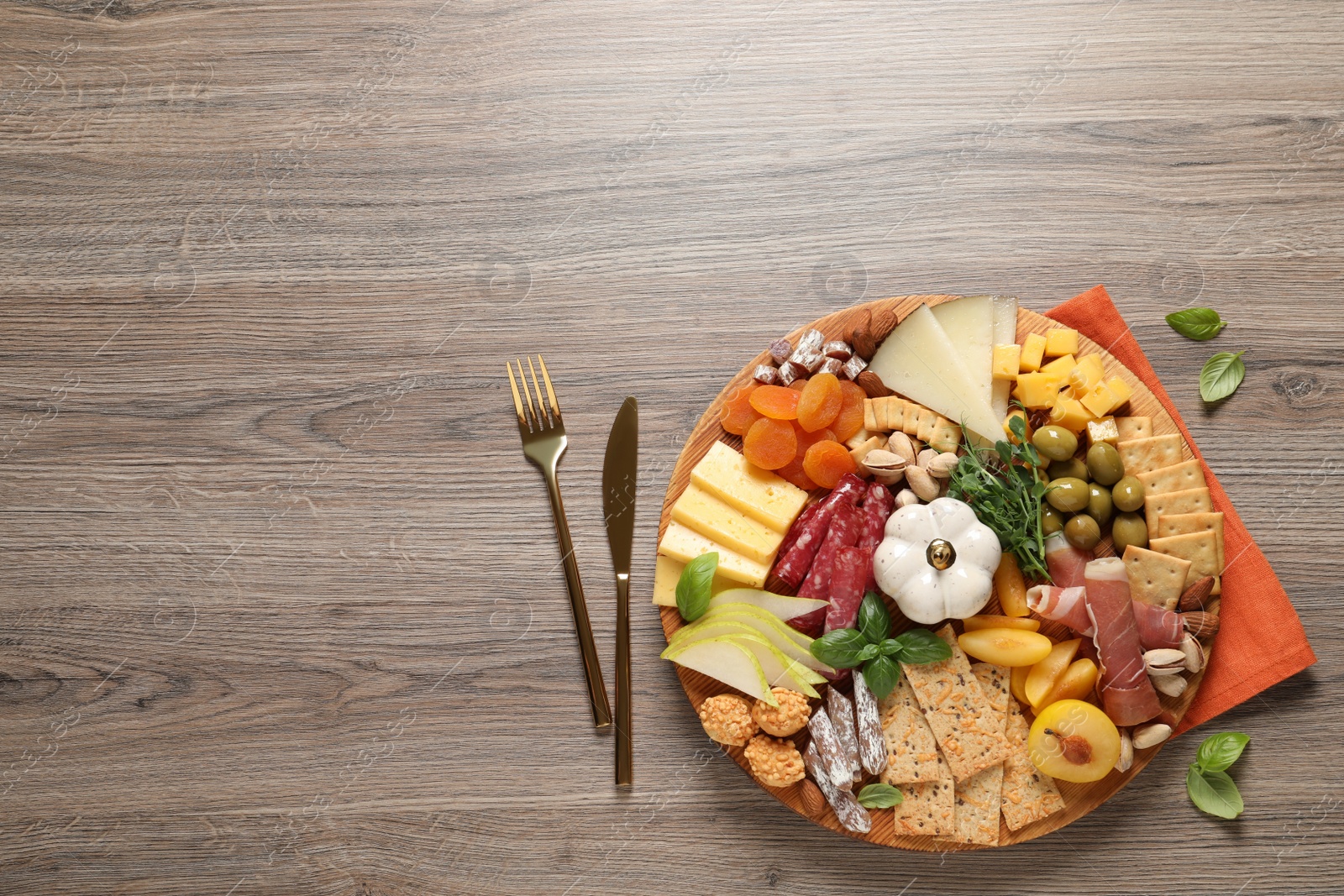 Photo of Different tasty appetizers on wooden table, flat lay. Space for text