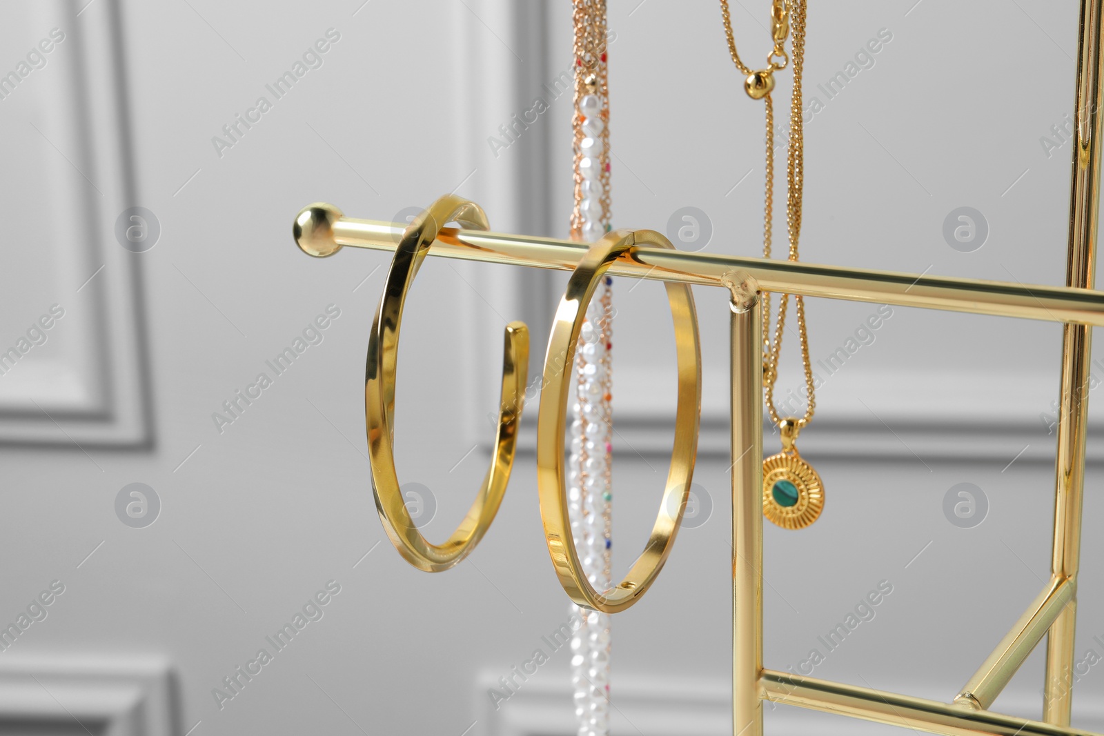 Photo of Holder with set of beautiful bijouterie, closeup