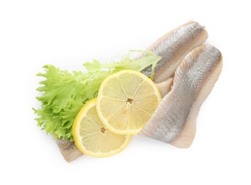 Photo of Delicious salted herring fillets with lettuce and lemon slices on white background, top view