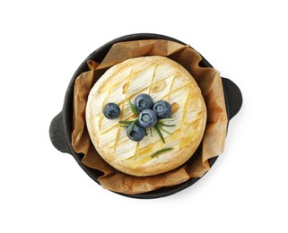 Tasty baked brie cheese with rosemary and blueberries isolated on white, top view
